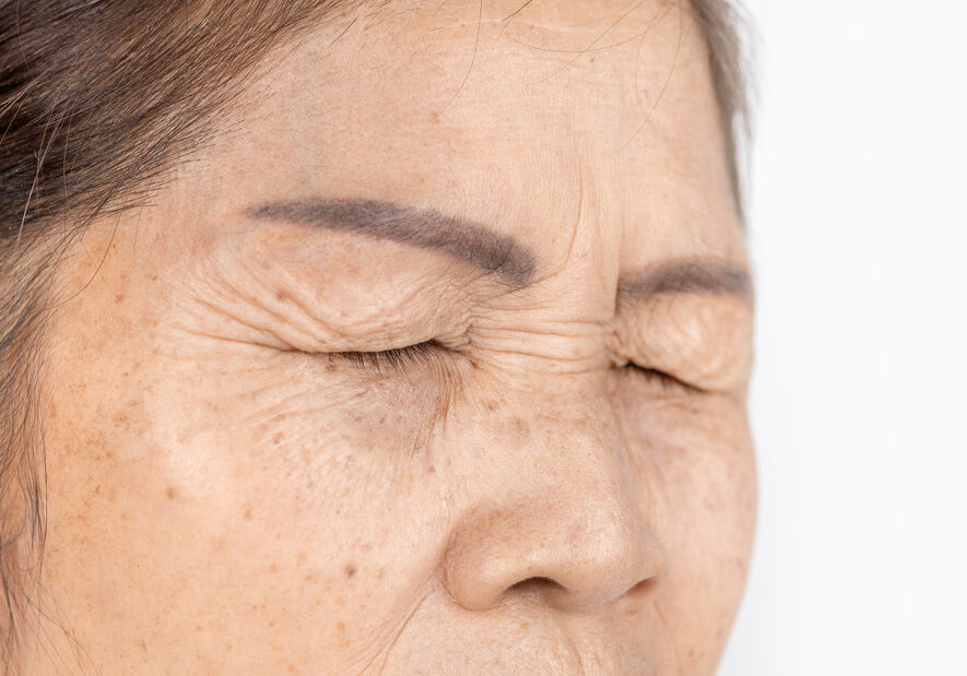 wrinkle freckles and skin line on close up elderly asian woman face 60-70 years old which closing eyes, healthy skin care concept